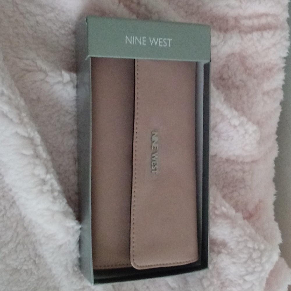 Nine West beige colored large wallet.